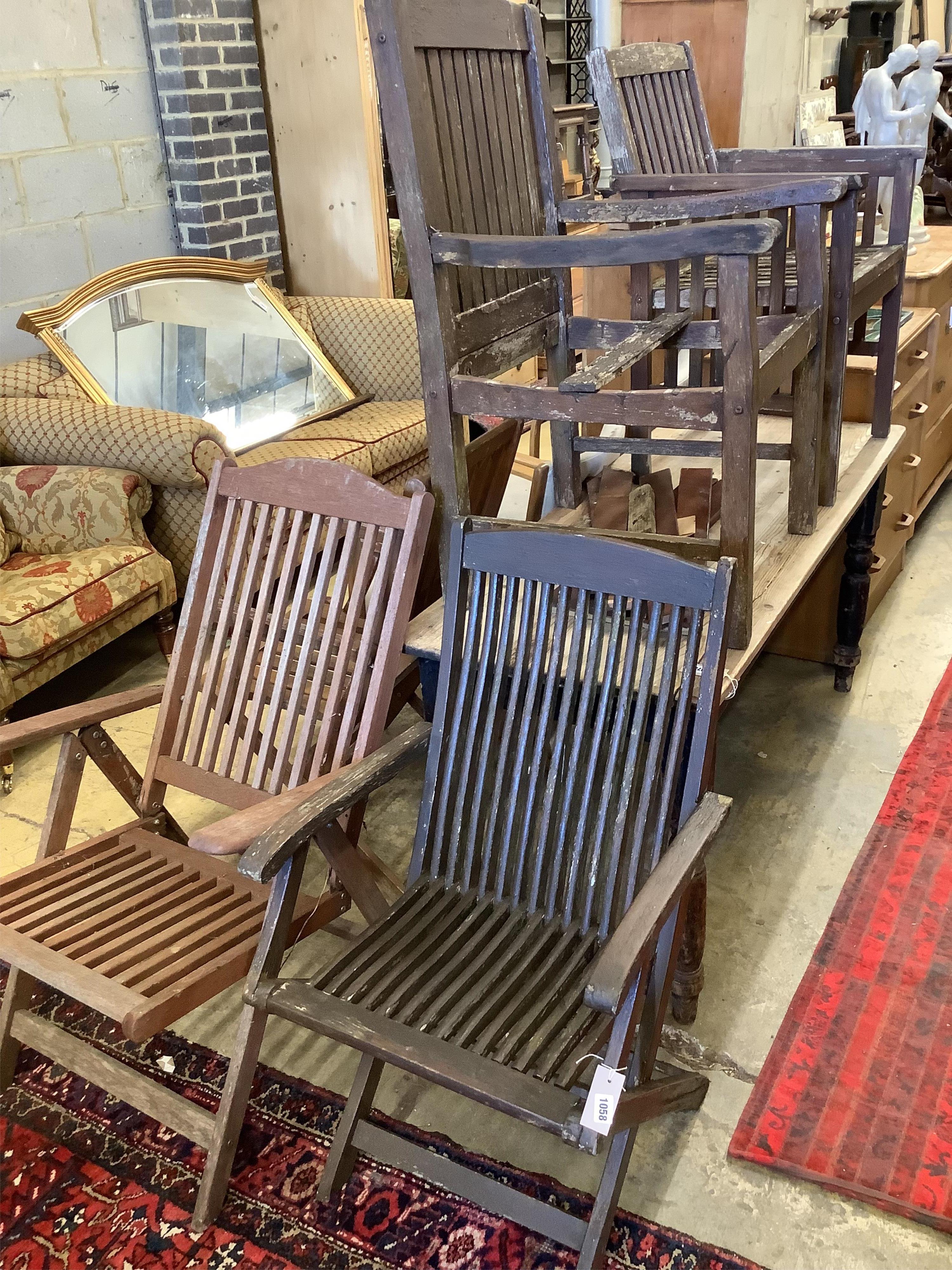Three various teak folding garden elbow chairs together with two other teak garden chairs